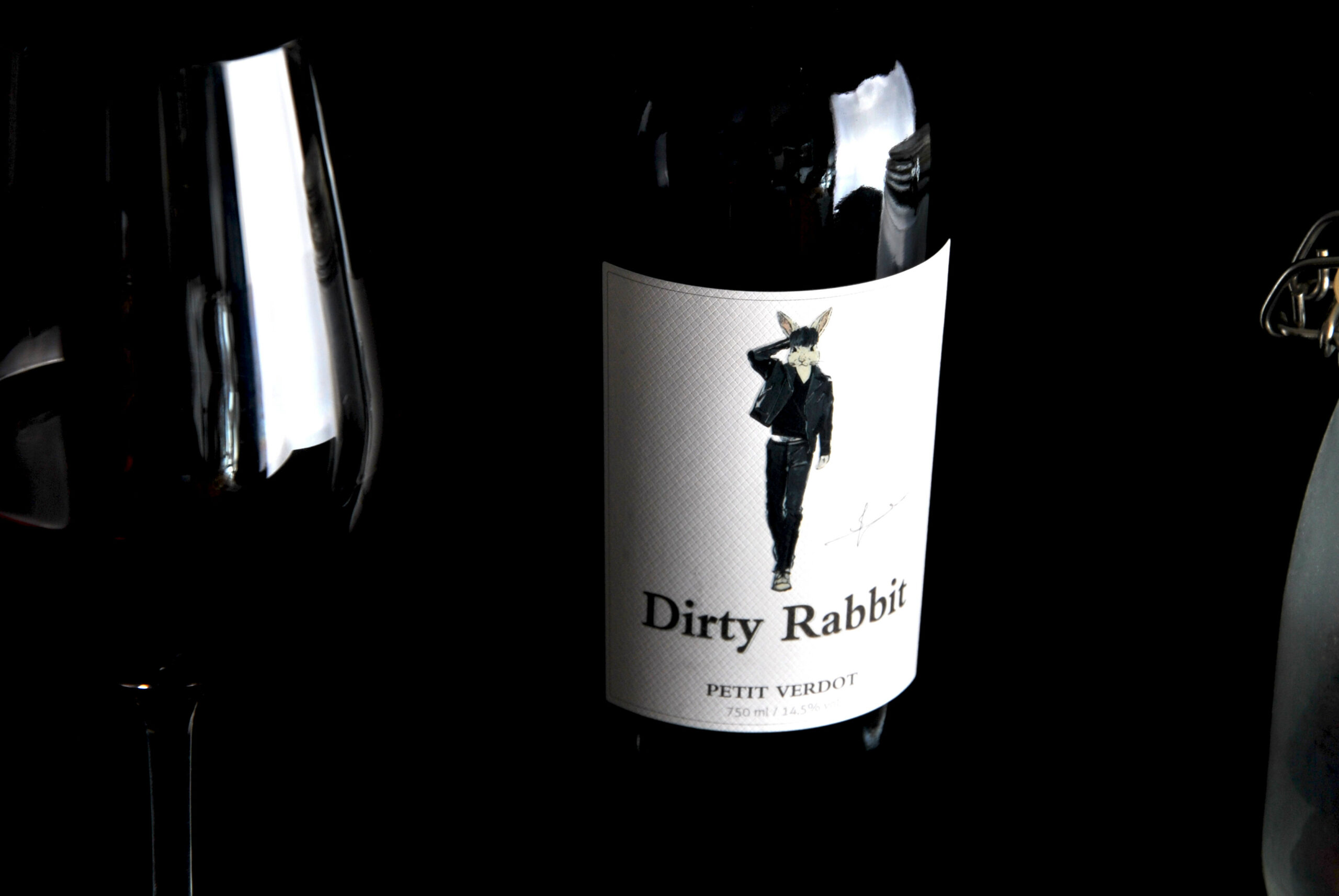 Dirty Rabbit Petit Verdot wine bottle and its illustrated label