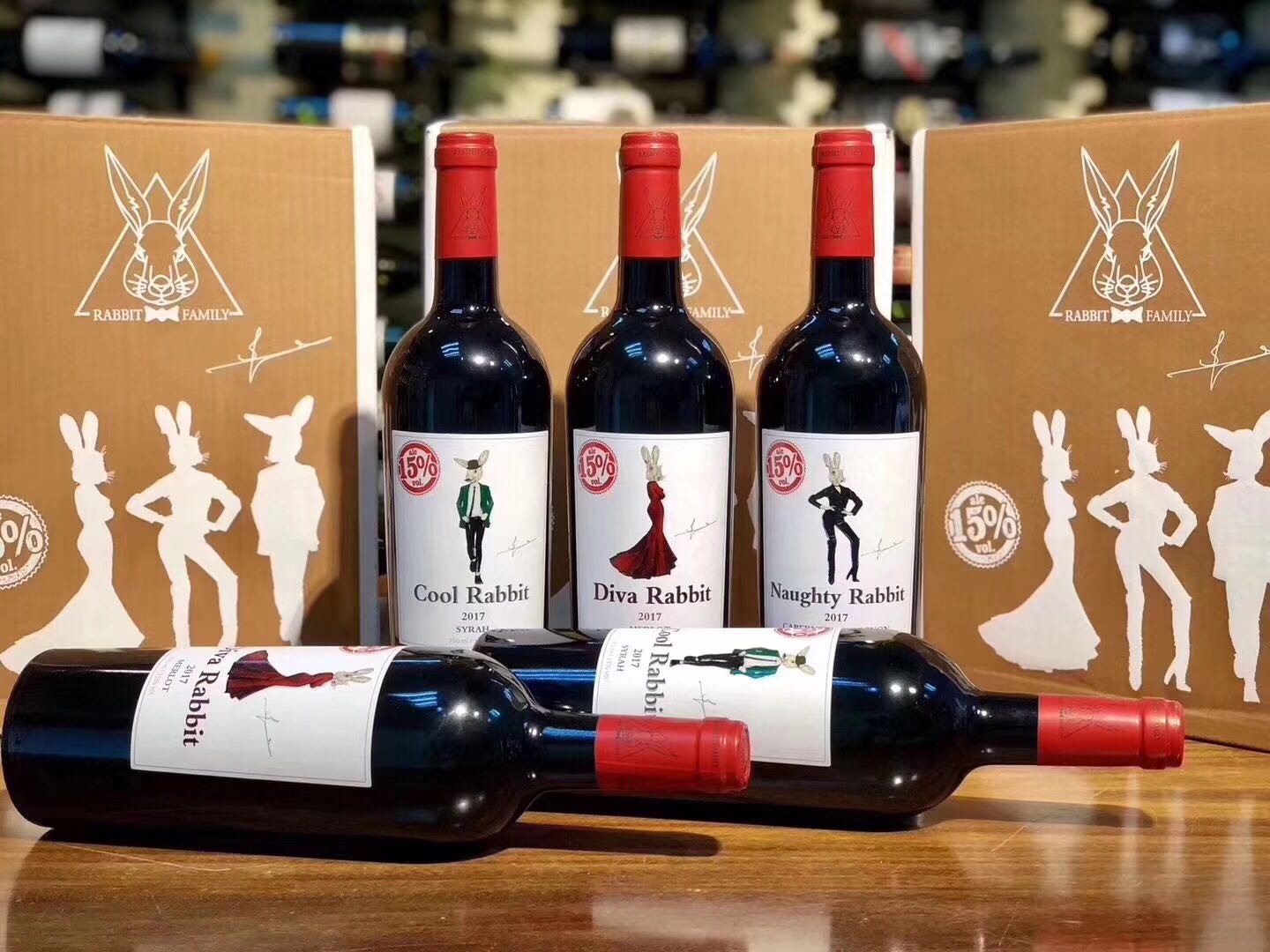 Cool, Diva and Naughty Rabbit red wine bottles displayed beside branded cartons